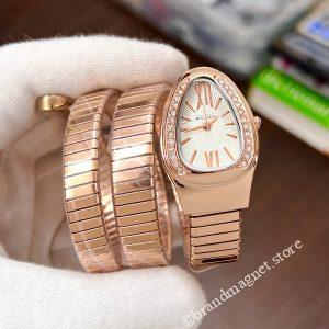 Watch with snake design and cream dial from Brand Magnet